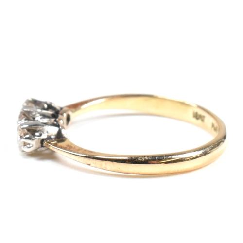 88 - An 18ct gold, platinum and diamond trilogy ring. The ring having three shared claw set round cut dia... 