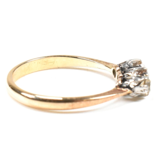 88 - An 18ct gold, platinum and diamond trilogy ring. The ring having three shared claw set round cut dia... 