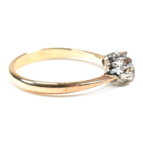 88 - An 18ct gold, platinum and diamond trilogy ring. The ring having three shared claw set round cut dia... 