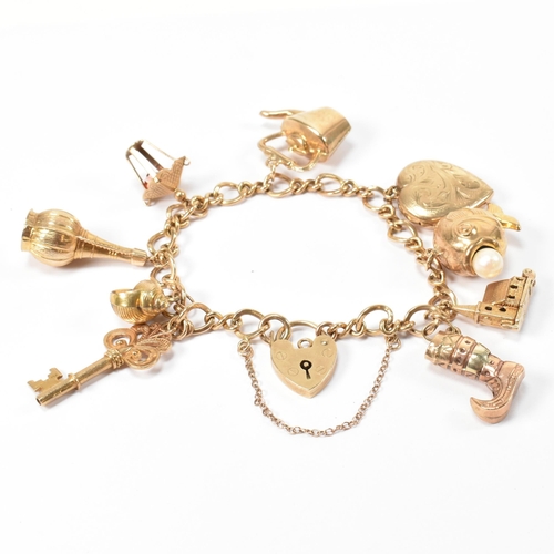 89 - A hallmarked 9ct gold charm bracelet. The hallmarked 9ct gold fancy link chain bracelet strung with ... 