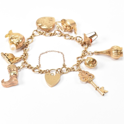 89 - A hallmarked 9ct gold charm bracelet. The hallmarked 9ct gold fancy link chain bracelet strung with ... 