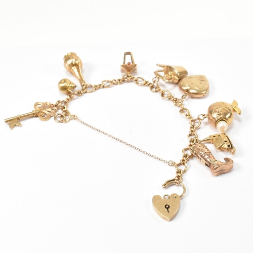 89 - A hallmarked 9ct gold charm bracelet. The hallmarked 9ct gold fancy link chain bracelet strung with ... 