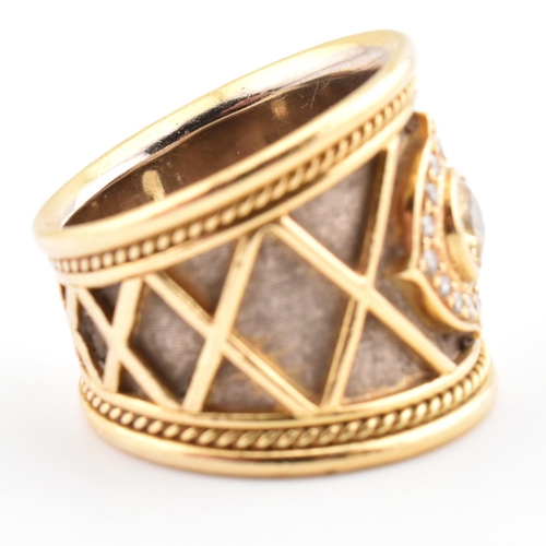 9 - Elizabeth Gage; a hallmarked 18ct gold, diamond and yellow sapphire templar ring. The 18ct yellow go... 