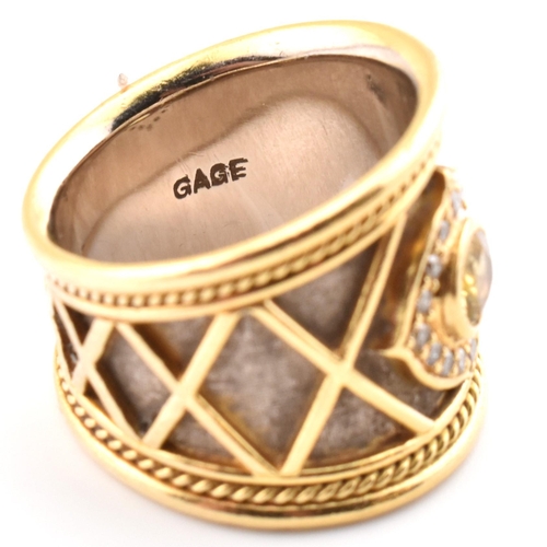 9 - Elizabeth Gage; a hallmarked 18ct gold, diamond and yellow sapphire templar ring. The 18ct yellow go... 