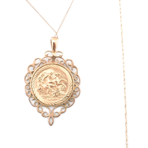 90 - A hallmarked 9ct gold mounted St Christopher pendant necklace. The hallmarked 9ct yellow gold curb l... 