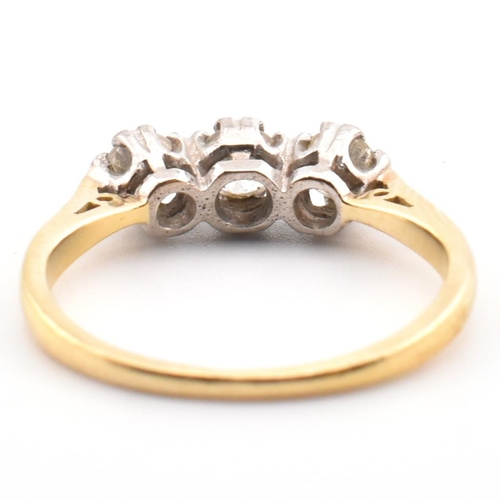 91 - A hallmarked 18ct gold and diamond trilogy ring. The 18ct yellow gold ring having three graduating d... 