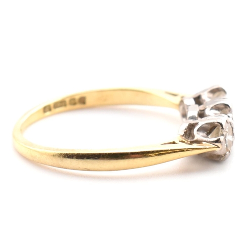 91 - A hallmarked 18ct gold and diamond trilogy ring. The 18ct yellow gold ring having three graduating d... 