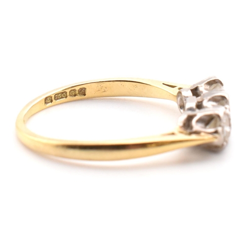 91 - A hallmarked 18ct gold and diamond trilogy ring. The 18ct yellow gold ring having three graduating d... 