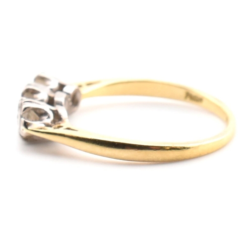 91 - A hallmarked 18ct gold and diamond trilogy ring. The 18ct yellow gold ring having three graduating d... 