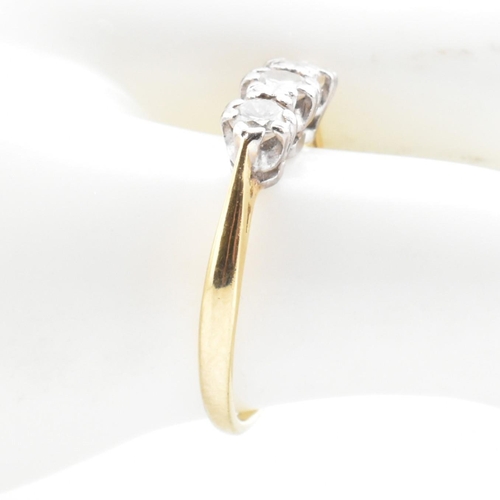 91 - A hallmarked 18ct gold and diamond trilogy ring. The 18ct yellow gold ring having three graduating d... 