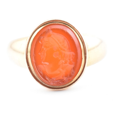 93 - A gold and carnelian intaglio signet ring. The signet ring set with a carnelian intaglio seal depict... 