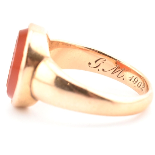 93 - A gold and carnelian intaglio signet ring. The signet ring set with a carnelian intaglio seal depict... 