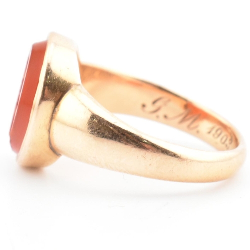 93 - A gold and carnelian intaglio signet ring. The signet ring set with a carnelian intaglio seal depict... 