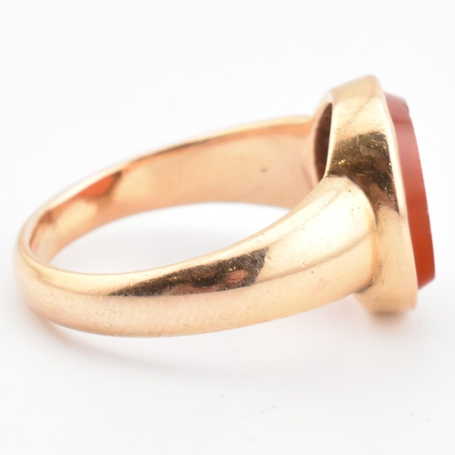 93 - A gold and carnelian intaglio signet ring. The signet ring set with a carnelian intaglio seal depict... 