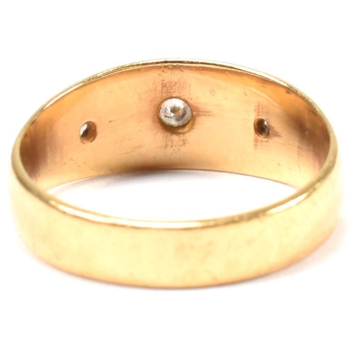 97 - A hallmarked 18ct gold and diamond gypsy ring. The antique ring having three star set old cut diamon... 