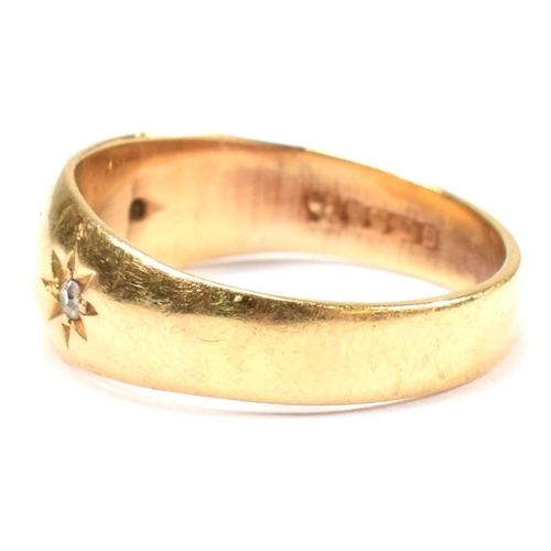 97 - A hallmarked 18ct gold and diamond gypsy ring. The antique ring having three star set old cut diamon... 