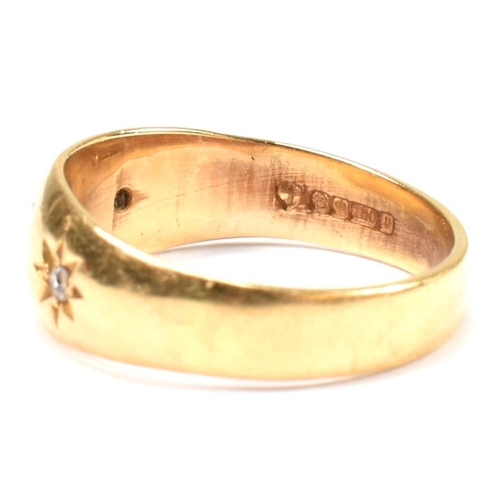 97 - A hallmarked 18ct gold and diamond gypsy ring. The antique ring having three star set old cut diamon... 