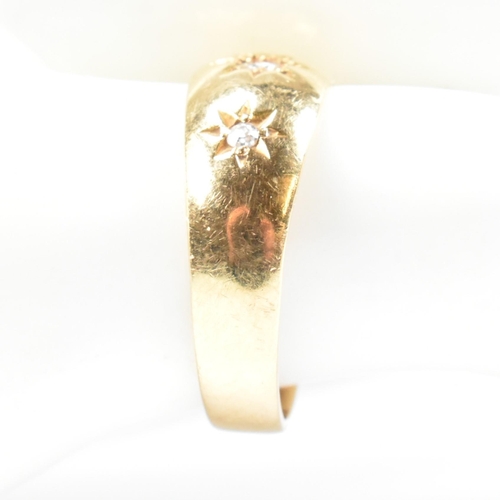 97 - A hallmarked 18ct gold and diamond gypsy ring. The antique ring having three star set old cut diamon... 