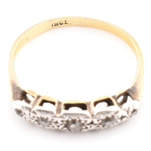 98 - A 18ct gold and diamond five stone ring. The 18ct ring set having five graduating illusion set diamo... 