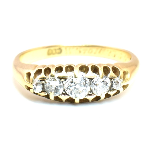 120a - An 18ct gold and diamond five stone ring. The 18ct yellow gold ring set with a single row of five ol... 