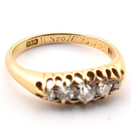 120a - An 18ct gold and diamond five stone ring. The 18ct yellow gold ring set with a single row of five ol... 