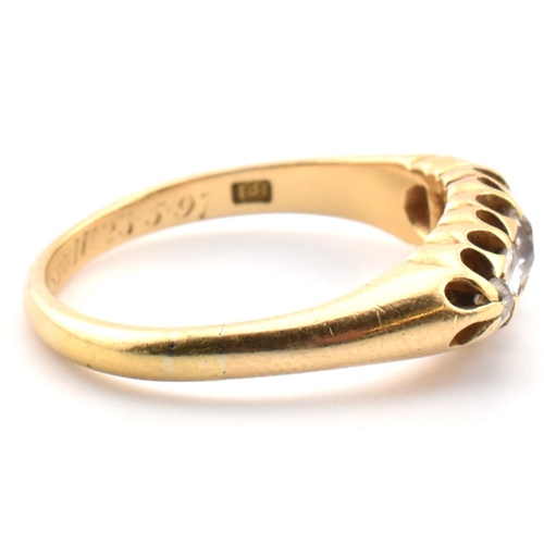 120a - An 18ct gold and diamond five stone ring. The 18ct yellow gold ring set with a single row of five ol... 