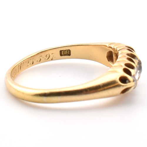 120a - An 18ct gold and diamond five stone ring. The 18ct yellow gold ring set with a single row of five ol... 