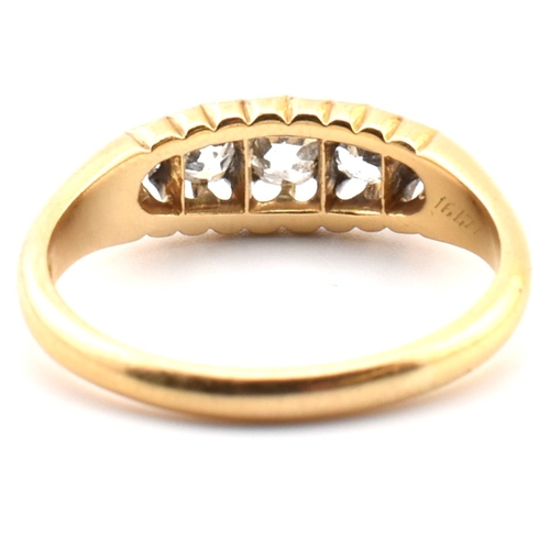 120a - An 18ct gold and diamond five stone ring. The 18ct yellow gold ring set with a single row of five ol... 