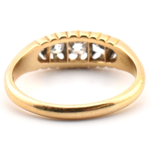 120a - An 18ct gold and diamond five stone ring. The 18ct yellow gold ring set with a single row of five ol... 