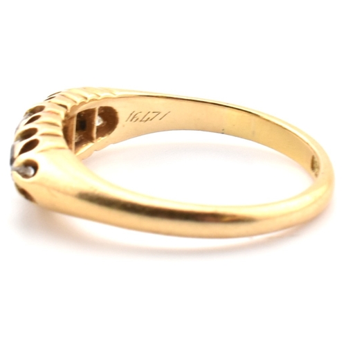 120a - An 18ct gold and diamond five stone ring. The 18ct yellow gold ring set with a single row of five ol... 