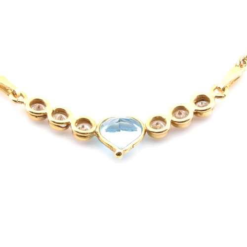 155a - A hallmarked 18ct gold, topaz and CZ pendant necklace. The Italian 18ct yellow gold necklace having ... 