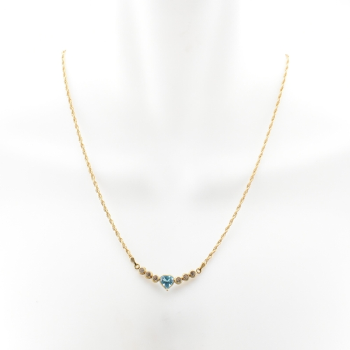 155a - A hallmarked 18ct gold, topaz and CZ pendant necklace. The Italian 18ct yellow gold necklace having ... 