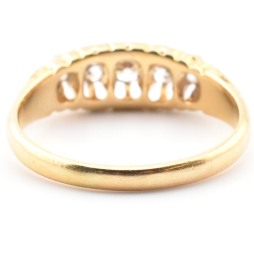 45a - An Edwardian hallmarked 18ct gold and diamond five stone gypsy ring. The 18ct yellow gold ring set w... 