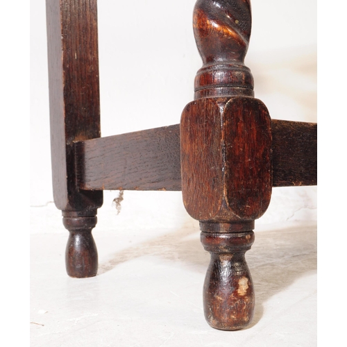 1000 - An early 20th century Edwardian oak wood umbrella / stick stand. The stick stand raised on rounded b... 