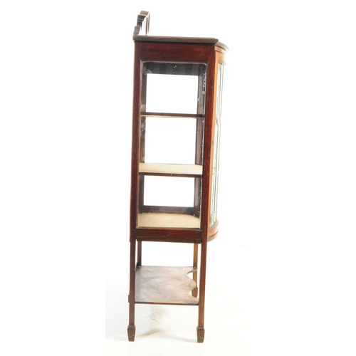 1004 - Edwardian gallery back inlaid display cabinet. Bow and glazed stained lead front with a series of th... 