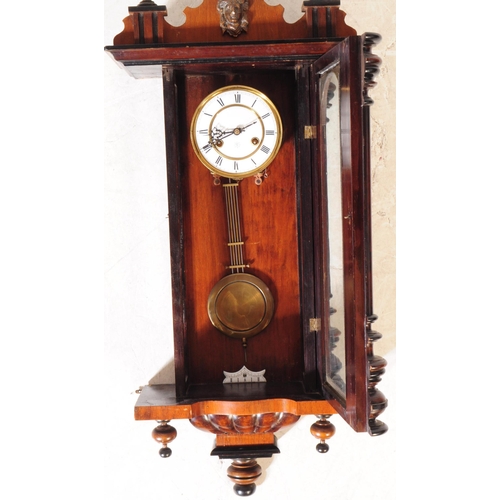 1007 - A 19th century Victorian mahogany Vienna regulatory wall clock. The clock having Gothic inspired ped... 