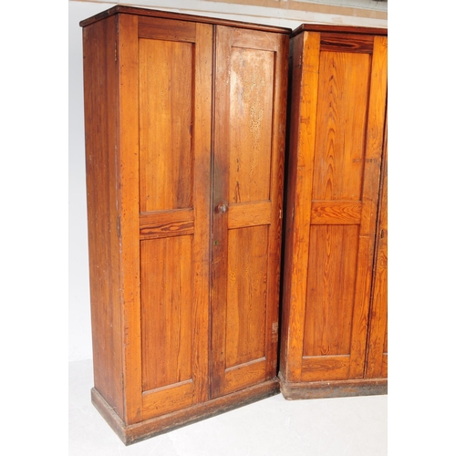 1008 - A pair of early 20th century oak wood church / Sunday school cupboards. The cupboards raised on plin... 