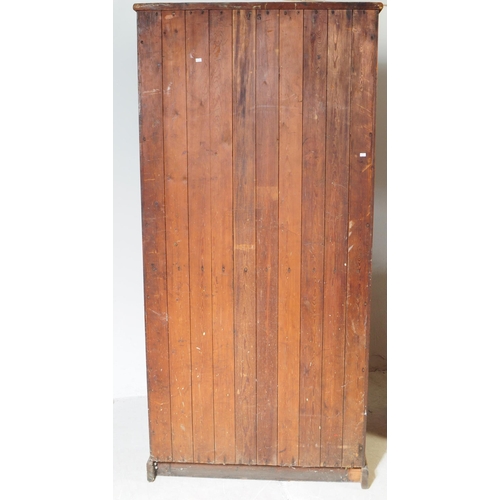 1008 - A pair of early 20th century oak wood church / Sunday school cupboards. The cupboards raised on plin... 