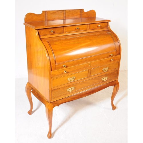 1013 - A French Directoire revival rosewood barrel top cylinder bureau desk. The desk raised on cabriole le... 