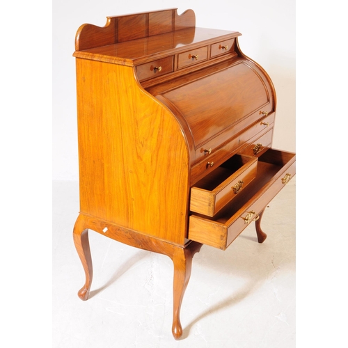 1013 - A French Directoire revival rosewood barrel top cylinder bureau desk. The desk raised on cabriole le... 