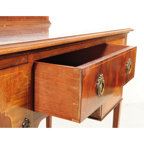 1016 - An early 20th century Edwardian mahogany writing table desk. The writing table raised on tapered squ... 