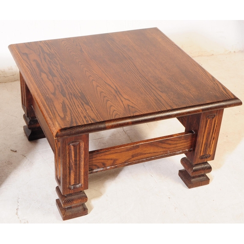 1019 - Banks of Bristol - A pair of 20th century oak wood coffee tables. The tables each raised on four squ... 