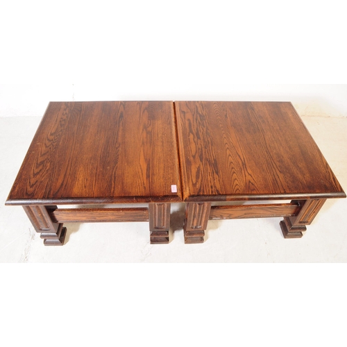 1019 - Banks of Bristol - A pair of 20th century oak wood coffee tables. The tables each raised on four squ... 