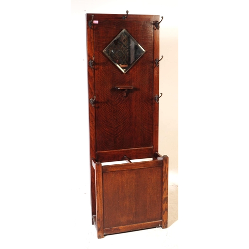 1020 - An early 20th century circa 1930s/1940s oak wood hall stand. The hall stand of rectangular form, wit... 