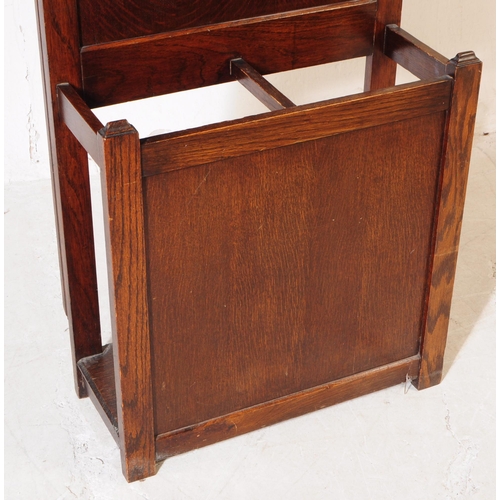 1020 - An early 20th century circa 1930s/1940s oak wood hall stand. The hall stand of rectangular form, wit... 