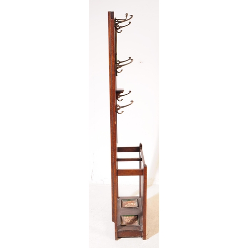 1020 - An early 20th century circa 1930s/1940s oak wood hall stand. The hall stand of rectangular form, wit... 