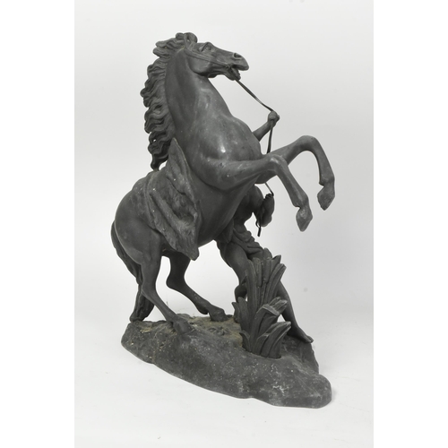 1027 - A pair of 19th century Victorian era spelter marley horse figures. The horses being modelled rearing... 