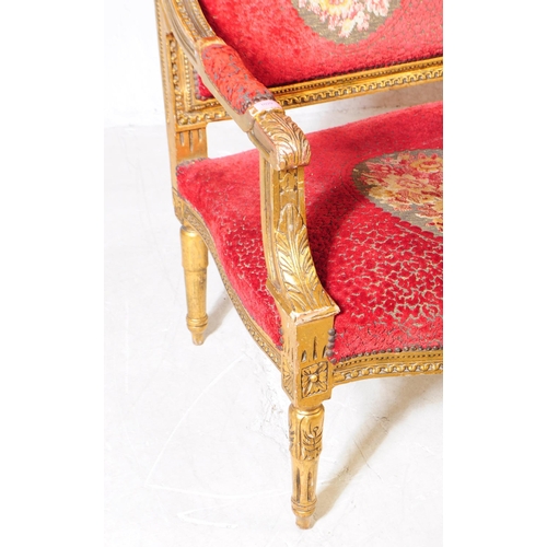 1029 - A 19th century Louis XV French giltwood three seater canape salon sofa settee. The canape having orn... 