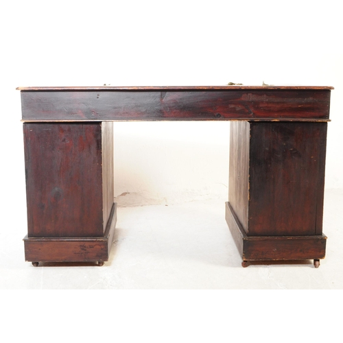 1030 - A 19th century Victorian mahogany twin pedestal writing desk. The desk having green gilt tooled leat... 