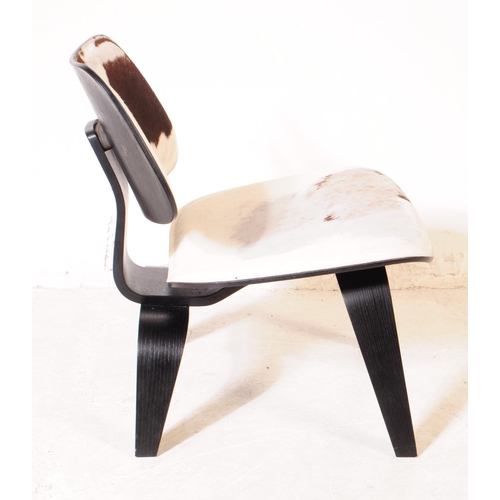 613 - Vitra Eames - A vintage Vitra Eames plywood and calf skin chair. The chair having back and seat upho... 